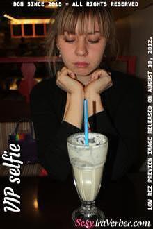 I like to drink a sweet creamy milkshakes. My friend made this picture 
when as we were meeting for the first time. It was very cold and I was 
trying not to react.